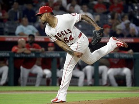 Los Angeles Angels starting pitcher Felix Pena throws against the Texas Rangers during the first inning of a baseball game in Anaheim, Calif., Monday, Sept. 24, 2018.