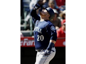 Seattle Mariners designated hitter Daniel Vogelbach reacts at the plate after hitting a two-RBI home run during the fourth inning of a baseball game against the Los Angeles Angels in Anaheim, Calif., Sunday, Sept. 16, 2018.