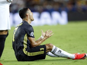 Juventus forward Cristiano Ronaldo reacts after receiving a red card during the Champions League, group H soccer match between Valencia and Juventus, at the Mestalla stadium in Valencia, Spain, Wednesday, Sept. 19, 2018.