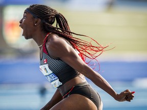 In this Aug. 11 file photo, Crystal Emmanuel celebrates her bronze-medal run in the women's 100 metres at the NACAC Championships in Toronto.