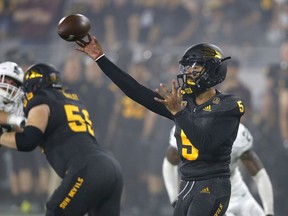 Arizona State quarterback Manny Wilkins (5) throws a pass against Michigan State during the first half of an NCAA college football game Saturday, Sept. 8, 2018, in Tempe, Ariz.