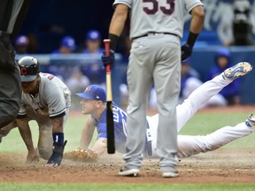 Cleveland Indians third baseman Jose Ramirez scores on a wild pitch in front of Blue Jays relief pitcher Mark Leiter Jr.  during the sixth inning of their game in Toronto on Saturday night.