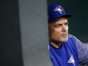 Toronto Blue Jays manager John Gibbons sits in the dugout before a baseball game against the Baltimore Orioles, Tuesday, Sept. 18, 2018, in Baltimore.