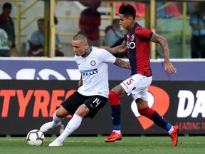 Inter Milan's Radja Nainggolan is challenged by Bologna's Erick Pulgar, right, during the Serie A soccer match between Bologna and Inter Milan at the Renato Dall'Ara stadium in Bologna, Italy, Saturday, Sept. 1, 2018.