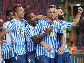FILE -  This Sunday, Aug. 19, 2018 file photo shows Spal's Jasmin Kurtic, 2nd left, celebrating with teammates after scoring during the Serie A soccer match between Bologna and Spal, at the Dall'ara Stadium in Bologna, Italy.  Through four rounds, the Ferrara-based team sits second in the standings, behind only seven-time defending champion Juventus and ahead of Napoli, last year's runner-up, on goal difference.