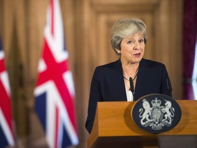 British Prime Minister Theresa May makes a statement on Brexit negotiations with the European Union, at 10 Downing Street, in London, Friday, Sept. 21, 2018.