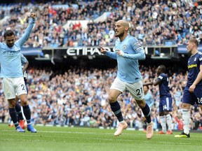 Manchester City's David Silva, centre, celebrates after scoring his side's second goal during the English Premier League soccer match between Manchester City and Fulham at Etihad stadium in Manchester, England, Saturday, Sept. 15, 2018.