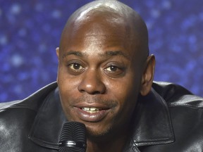 FILE - In this Sept. 9, 2018 file photo, Dave Chappelle speaks at the press conference at the Toronto International Film Festival at the TIFF Bell Lightbox in Toronto. Chappelle is among eight recipients who will honored by Harvard University with the W. E. B. Du Bois Medal during a ceremony on Oct. 11, for contributions to black history and culture.