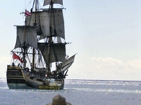 FILE - In this Nov. 15, 1999, file photo, people watch as a replica of the HMB Endeavour leaves Honolulu, as it embarked on a four-year, around-the-world cruise. The original vessel was commanded by Capt. James Cook in the 1700s when he became the first European to chart Australia's East Coast. Researchers said in September 2018 they've found a site where they think the ship that Cook used sank and may be located, and are planning an excavation off the coast of Rhode Island.