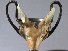 In this July 27, 2018, photo provided by the British Museum of London, a drinking vessel shaped like a donkey head and believed to date to 520-500 B.C. is depicted. A new exhibition at the Harvard Art Museums explores how the ancients literally partied in beast mode, with cups shaped like the beings they revered the most: animals. (British Museum/Harvard Art Museums via AP)