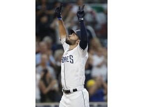 San Diego Padres' Eric Hosmer reacts as he returns to the plate after hitting a three-run home run against the Texas Rangers during the third inning of a baseball game in San Diego, Saturday, Sept. 15, 2018.