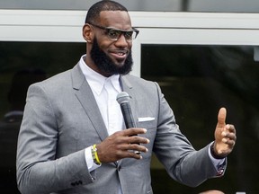 FILE - In this Monday, July 30, 2018, file photo, LeBron James speaks at the opening ceremony for the I Promise School in Akron, Ohio. James says he "stands with Nike," a clear reference to the company's Colin Kaepernick ad campaign. The basketball superstar- and new Los Angeles Laker - made the remarks as he received an award Tuesday, Sept. 4, 2018, for his style and his philanthropy from the Harlem Fashion Row.