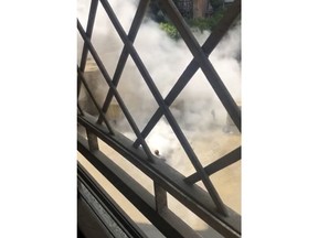 Smoke rises after a man carrying a crude explosive device exploded near the heavily fortified U.S. Embassy, Cairo, Egypt, Tuesday, Sept. 4, 2018. Officials said the man, whom they did not identify, was intercepted outside the concrete blast barriers that encircle the U.S. and nearby British embassies in the leafy district of Garden City.