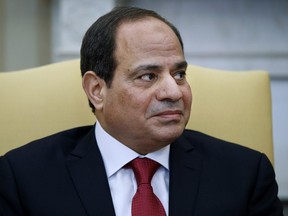 FILE - In this April 3, 2017 file photo, Egyptian President Abdel-Fattah El-Sissi listens during a meeting with President Donald Trump in the Oval Office of the White House in Washington. Echoing Trump's rhetoric, authorities in Egypt are taking aim at an alleged barrage of "fake news" they say is meant to sow division and undermine the rule of general-turned-president el-Sissi. Government critics denounce the measures as the latest attempt to suppress dissent and silence what is left of independent journalism.