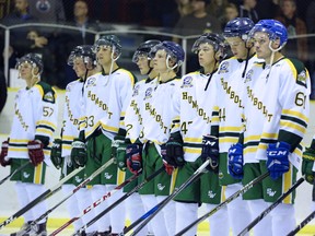 The Humboldt Broncos take part in a ceremony honouring late head coach and GM Darcy Haugan before an exhibition game against the Whitecourt Wolverines in Peace River, Alta., Haugan's hometown, on Sept. 1.