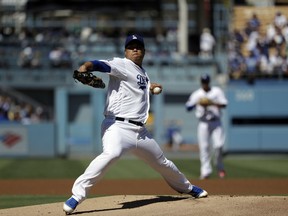 Los Angeles Dodgers starting pitcher Hyun-Jin Ryu throws to the San Diego Padres during the first inning of a baseball game Sunday, Sept. 23, 2018, in Los Angeles.