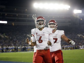 Fresno State quarterback Marcus McMaryion (6) celebrates after scoring a rushing touchdown against UCLA during the first half of an NCAA college football game Saturday, Sept. 15, 2018, in Pasadena, Calif.