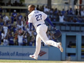 Los Angeles Dodgers' Matt Kemp celebrates after driving in two-runs with a double during the ninth inning of a baseball game against the Arizona Diamondbacks Sunday, Sept. 2, 2018, in Los Angeles. Los Angeles won the game 3-2.