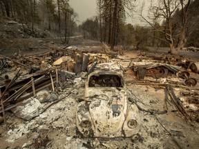 A scorched VW Beetle rests in a clearing after the Delta Fire burned through the Lamoine community in the Shasta-Trinity National Forest, Calif., on Thursday, Sept. 6, 2018.