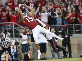Stanford wide receiver JJ Arcega-Whiteside (19) catches a touchdown pass against San Diego State cornerback Ron Smith (17) during the first half of an NCAA college football game Friday, Aug. 31, 2018, in Stanford, Calif.