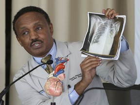 Dr. Osama Eltayeb, a cardiovascular surgeon who operated on heart transplant patient Sofia Sanchez at Ann & Robert H. Lurie Children's Hospital of Chicago, holds an X-ray of Sofia's new heart at a news conference Thursday, Sept. 20, 2018, in Chicago. Sanchez captured the nation's attention in August when her two birthday wishes came true within a week of each other, a visit from rap star Drake and a life-saving heart transplant.