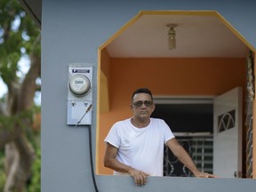 In this Sept. 8, 2018 photo, dialysis patient Juan Melendez poses for a photo, in Vieques, Puerto Rico. The 59-year-old said he will just keep treating the thrice-weekly flights he must make to the Puerto Rican mainland for treatments as a job.