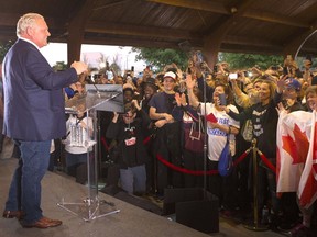 Ontario Premier Doug Ford greets the crowd as he takes the stage at Ford Fest in Vaughan , Ontario, on Saturday September 22, 2018.
