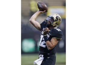 Colorado quarterback Steven Montez warms up for the team's NCAA college football game against UCLA on Friday, Sept. 28, 2018, in Boulder, Colo.