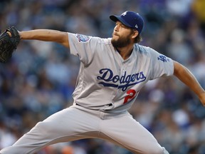 Los Angeles Dodgers starting pitcher Clayton Kershaw works against the Colorado Rockies in the first inning of a baseball game Friday, Sept. 7, 2018, in Denver.