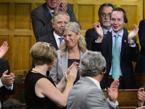 Ontario MP Leona Alleslev is applauded as she stands to ask a question during question period in the House of Commons on Parliament Hill in Ottawa on Monday, Sept. 17, 2018. Alleslev crossed the floor from the Liberals to the Conservatives prior to Question Period.