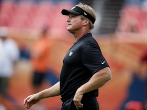 Oakland Raiders head coach Jon Gruden watches his team prior to an NFL football game against the Denver Broncos, Sunday, Sept. 16, 2018, in Denver.