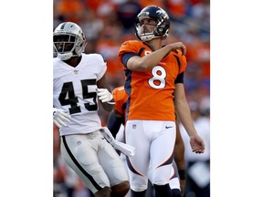Denver Broncos kicker Brandon McManus (8) watches his game-winning field goal split the uprights as Oakland Raiders defensive back Dominique Rodgers-Cromartie (45) looks on during the second half of an NFL football game, Sunday, Sept. 16, 2018, in Denver. The Broncos won 20-19.