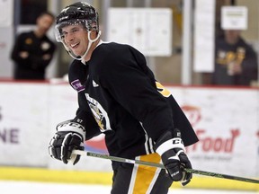 Pittsburgh Penguins' Sidney Crosby smiles as he skates during NHL hockey training camp, Friday, Sept. 14, 2018, in Cranberry Township, Pa. Halifax city staff are advising against naming a Halifax-area road after Sidney Crosby, saying Nova Scotia's hockey darling doesn't meet the existing criteria for commemorative naming because he isn't retired yet.