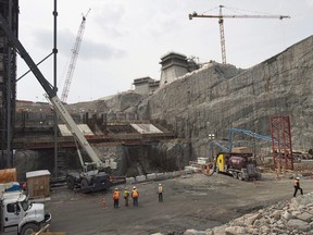 Public hearings will continue Monday morning for an independent inquiry into the issues surrounding the 12.7-billion-dollar Muskrat Falls hydro project on the lower Churchill River near Happy Valley-Goose Bay in Labrador. The construction site of the hydroelectric facility at Muskrat Falls, N.L., is seen on Tuesday, July 14, 2015.