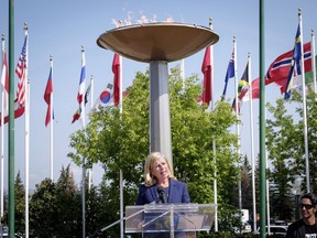 Mary Moran speaks during a press conference after being named the new Calgary 2026 Olympic bid committee CEO in Calgary on July 31, 2018. Calgarians will get a detailed look at how the city could host the 2026 Olympic and Paralympic Games when a draft plan is presented to city council Tuesday. Capital and operational costs, construction requirements and which sports would be held in which venues are expected to be unveiled by the bid corporation Calgary 2026.