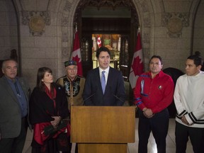 Three national Indigenous organizations will receive a combined $1.7 billion to spend on child care over the coming decade uner an agreement being unveiled today. Prime Minister Justin Trudeau speaks as he stands with leaders of the Congress of Aboriginal Peoples Chief Dwight Dorey, Native Women's Association President Dawn Lavell Harvard, Metis National council National President Clement Chartier, Assembly of First Nations National Chief Perry Bellegarde and Inuit Tapiriit Kanatami President Natan Obed following a meeting with national aboriginal organizations on Parliament Hill in Ottawa Wednesday December 16, 2015.