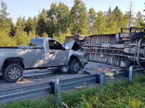 A pickup truck and flipped school bus are shown following an accident in Innisfil, Ont., on Wednesday, Sept. 12, in this handout photo.