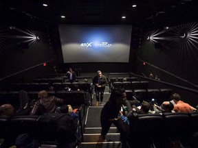 Cineplex Inc. says it has signed an agreement with immersive cinema company CJ 4DPLEX Co. Ltd. to bring 4DX technology to 13 cinemas. People mill about inside a Cineplex theatre as it opens its first 4DX sensory experience theatre which features 80 motion seats and other enhancements like water effects, snow, wind, lighting and scent in Toronto on Friday, November 4, 2016.