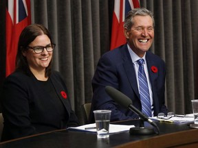 The Manitoba government is being urged to reduce the number of kids in child welfare by focusing more on supporting parents who struggle with poverty, addiction or housing issues. Then-Justice Minister Heather Stefanson, left, and Manitoba Premier Brian Pallister react to a question at the Manitoba Legislature in Winnipeg, Tuesday, November 7, 2017.