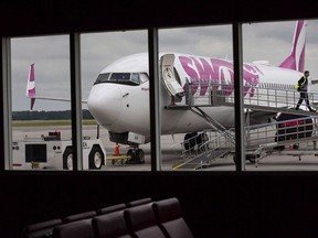 Swoop Airlines Boeing 737-800 on display during their media event, June 19, 2018 at John C. Munro International Airport in Hamilton, Ont. Swoop is extending the ultra low cost airline's reach to the Caribbean by adding seasonal flights to Jamaica from Hamilton, Ont. The WestJet Airlines subsidiary will fly twice a week to Montego Bay between Dec. 15 and April 24.