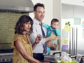 Actors Sarayu Blue, left, and Paul Adelstein are show in a scene from "I Feel Bad" in this undated handout photo. Actress Sarayu Blue says she's excited to be a part of South-Asian representation in the TV comedy world with the new series "I Feel Bad." Debuting Wednesday as a special preview on Global and NBC, the show stars Blue as a storyboard artist at a Los Angeles video-game company struggling to juggle her job, motherhood and her relationship with her husband, played by Paul Adelstein.