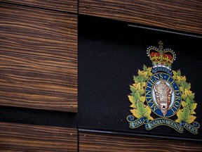 The RCMP logo is seen outside Royal Canadian Mounted Police "E" Division Headquarters, in Surrey, B.C., on Friday April 13, 2018. The family of an Indigenous man fatally shot by Saskatchewan RCMP says they want to know why he was shot when an inquest takes place in early December.