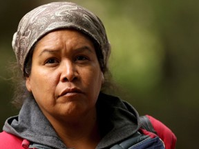 Tent City founder and homeless advocate Chrissy Brett looks on as residents were granted a 24-hour extension by BC Parks to remain at Goldstream Campground in Langford, B.C., on Thursday, September 20, 2018. A homeless woman living at a Vancouver Island campground with nearly three dozen others says vulnerable people aren't getting support from their families because officials have locked the gates to the public. Chrissy Brett is one of 34 people who moved a week ago to Goldstream Provincial Park in Langford, B.C., after being ousted from another park in nearby Saanich following a successful court injunction by that city.THE CANADIAN PRESS/Chad Hipolito