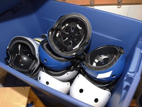 Safety helmets are seen in a container in a pre-K classroom at an elementary school in Oklahoma on Aug. 12, 2014. A University of Calgary researcher says new concussion guidelines in the U.S. will change care for all children with mild traumatic brain injuries. The guidelines were initiated by the U.S. Centers for Disease Control and Prevention. They include 19 sets of recommendations on the diagnosis, prognosis and treatment of mild concussions in children.THE CANADIAN PRESS/AP, Sue Ogrocki