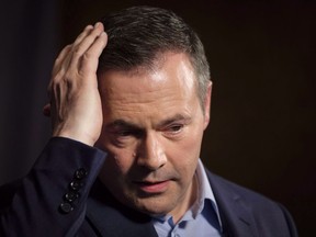 Jason Kenney adjusts his hair as he speaks to the media at his first convention as leader of the United Conservative Party in Red Deer, Alta., Sunday, May 6, 2018. The Alberta government says it will be doing follow-up "damage control" on opposition Leader Jason Kenney's visit to India.