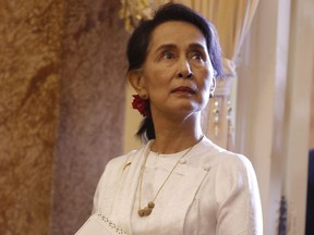 Myanmar's leader Aung San Suu Kyi waits for a meeting with Vietnam's President Tran Dai Quang (not pictured) at the Presidential Palace during the World Economic Forum on ASEAN in Hanoi, Vietnam, Thursday, Sept. 13, 2018. MPs have unanimously endorsed a Bloc Quebecois motion to revoke the honorary Canadian citizenship of Myanmar's de facto leader, Aung San Suu Kyi.