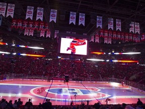 The Montreal Canadiens logo is projected onto the ice during a pre-game ceremony prior to their NHL hockey home opener against the Chicago Blackhawks, in Montreal on Tuesday, October 10, 2017.