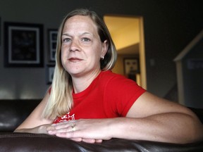 Jennifer McCrea is shown at her home in Calgary, Alberta on Tuesday, Oct. 4, 2016. The federal government is agreeing to a multi-million-dollar settlement with a group of women who were wrongly denied sickness benefits while they were on maternity leave. The settlement is conditional on court approval that is expected to happen in early December.