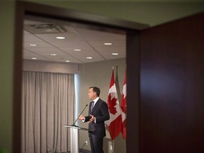 Federal Finance Minister Bill Morneau addresses journalists in Toronto on Thursday, August 30, 2018. The Canada Employment Insurance Commission says employment insurance premiums will be lower than expected in 2019. The commission says the rate will be $1.62 per $100 of insurable earnings, which is four cents lower than anticipated.