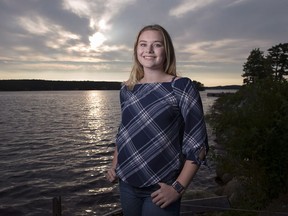 Stella Bowles, a teenage environmental crusader, stands by the LaHave River near her home in Upper LaHave, N.S. on Thursday, Aug. 23, 2018. Stella Bowles has won national science prizes and public service awards. She has a scholarship lined up from Western University, and a book about her work is being published this month. She's also 14, and just starting Grade 9.